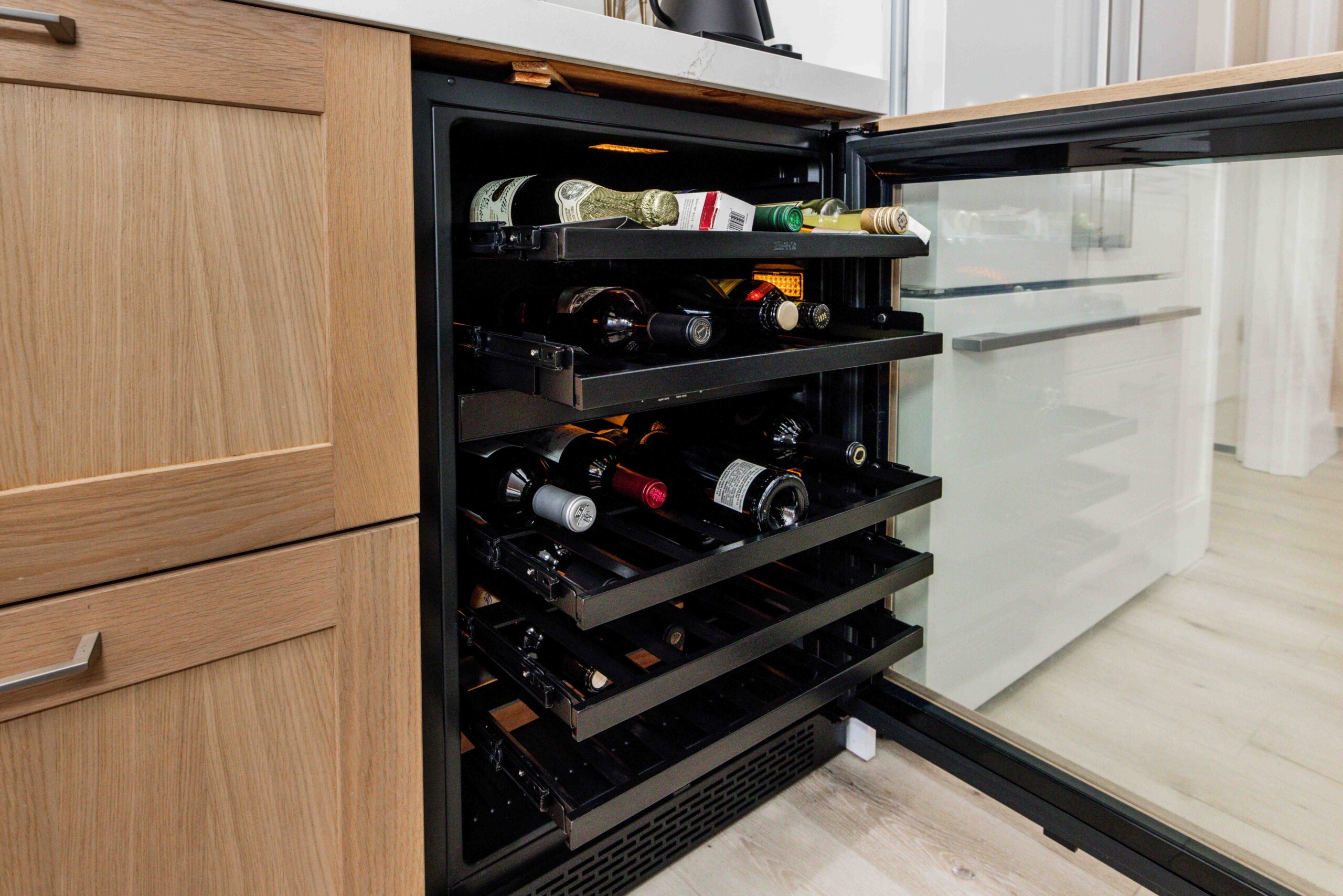 modern U-shaped kitchen with an island american walnut wood cabinets custom kitchen renovation design and integrated applicances