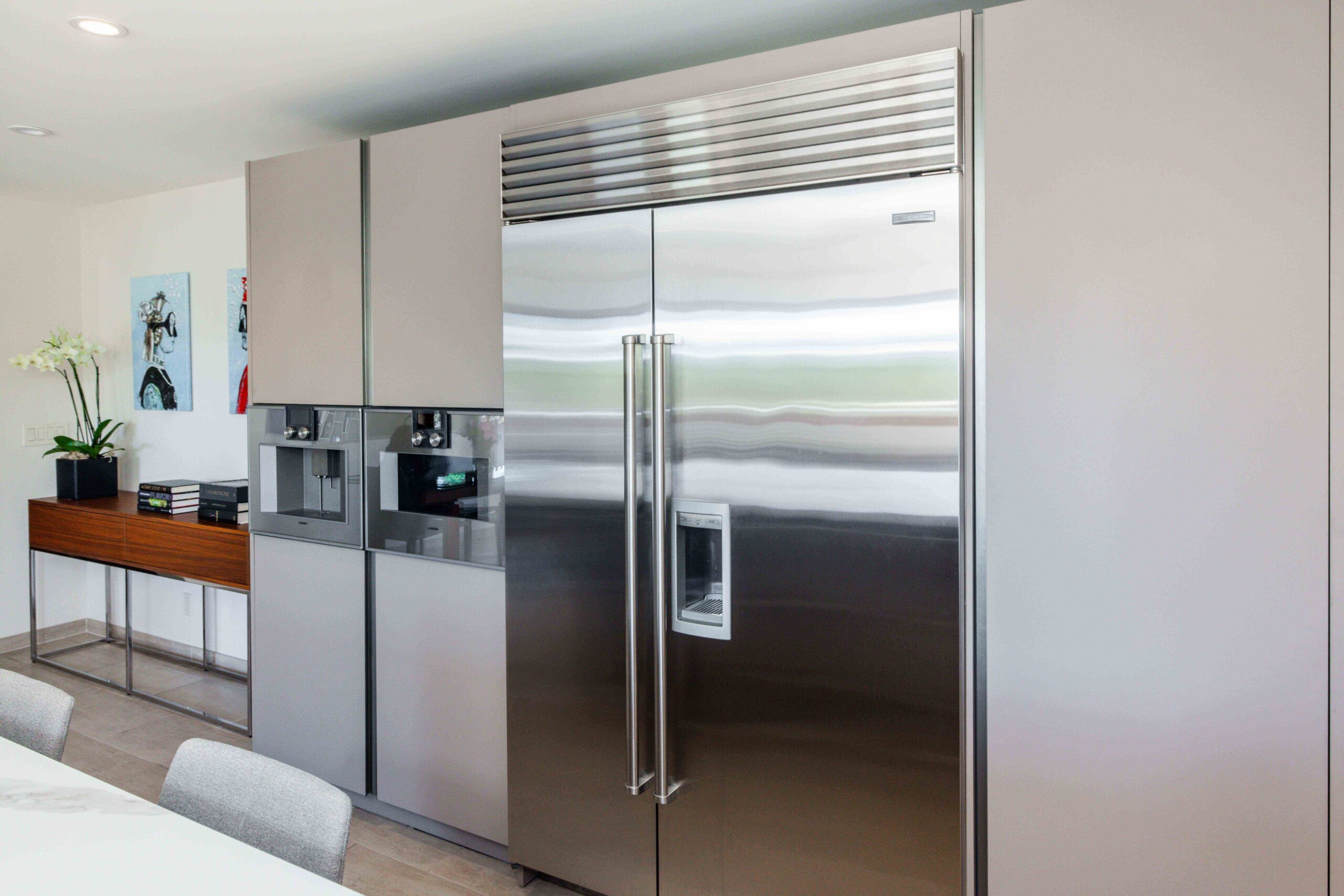 modern U-shaped kitchen with an island american walnut wood cabinets custom kitchen renovation design and integrated applicances